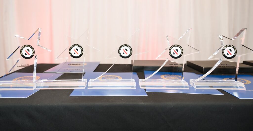Five clear, star shaped awards with GRCC Rockstar Awards logo centered on awards on a table